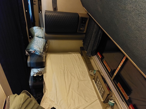 Roomette with bed deployed for nighttime