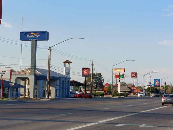 Commercial section of Route 66 with several motels and businesses.