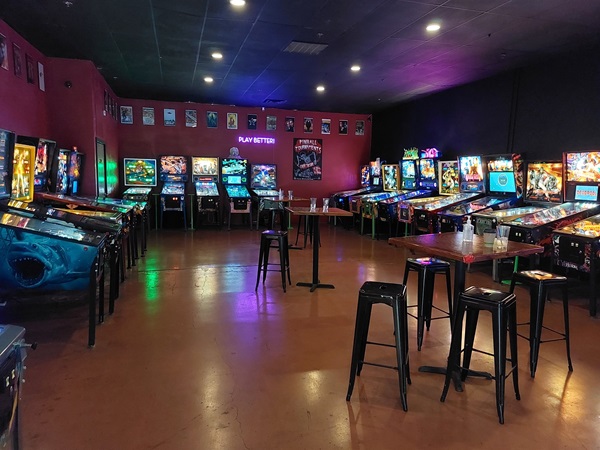 Picture of one of the rooms in the arcade showing about 20 different pinball machines